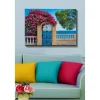 Canvastavla - Blomstrande bougainvillea vid en smidesgrind med havsutsikt